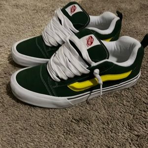 Green and yellow Vans knu skool